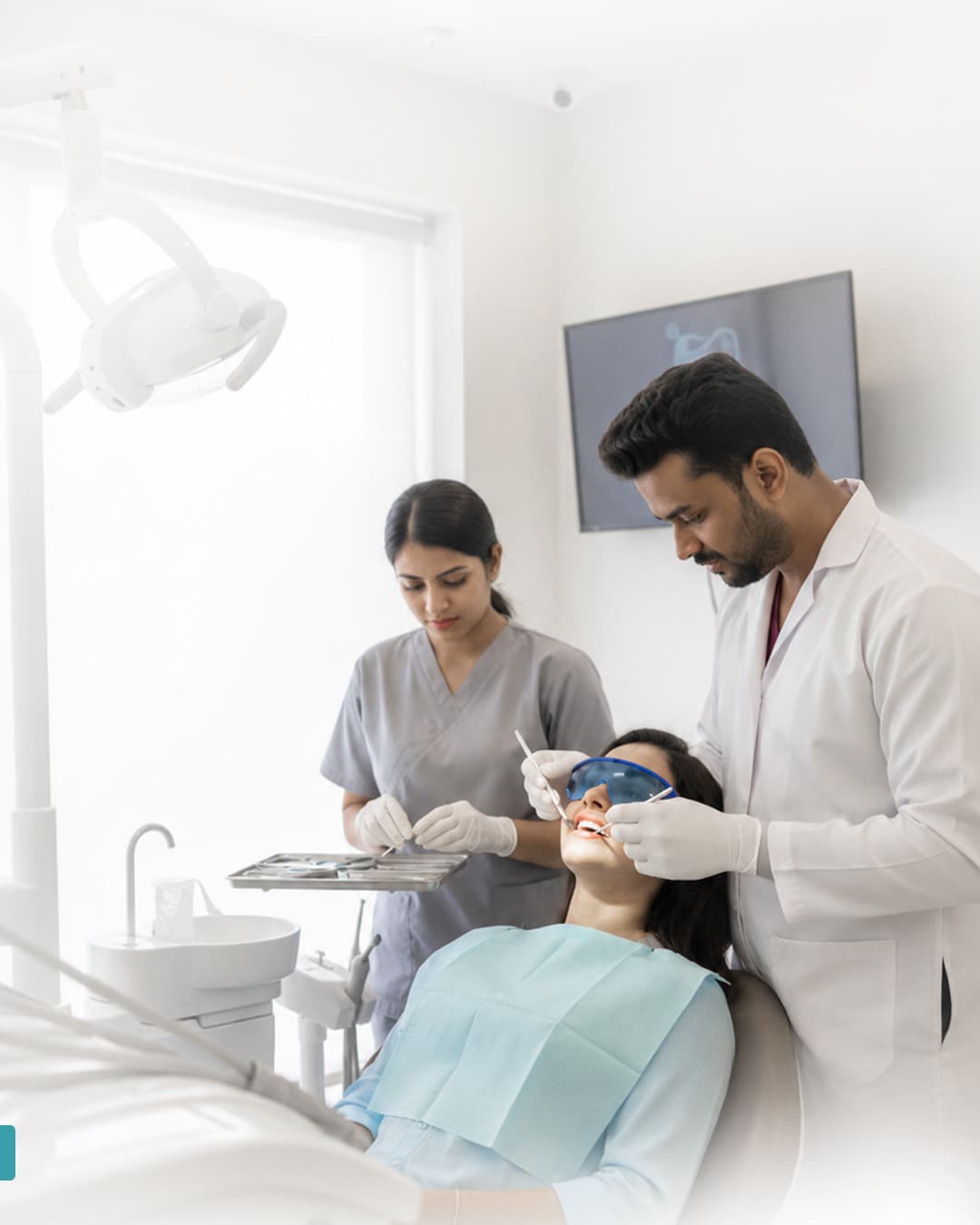 Two clinicians working together to treat a patient