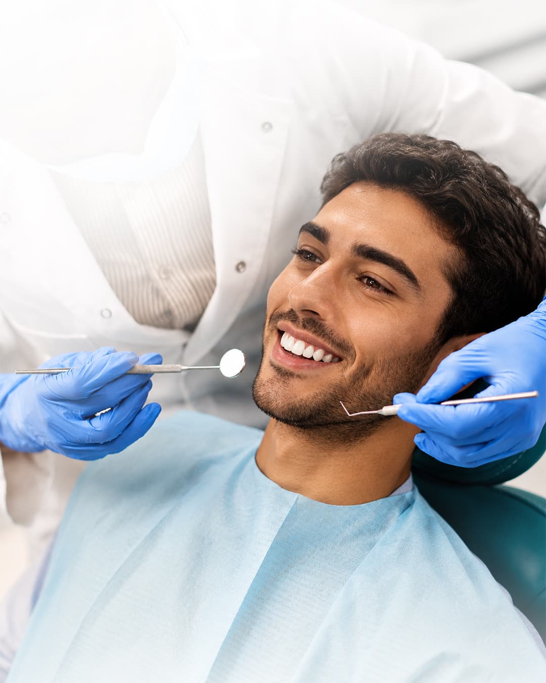 Smiling male patient relaxed in the dental chair
